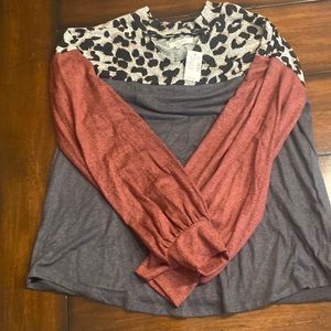 Maroon, gray and cheeta print long sleeve sweater. Cut out at the top. Maurice’s